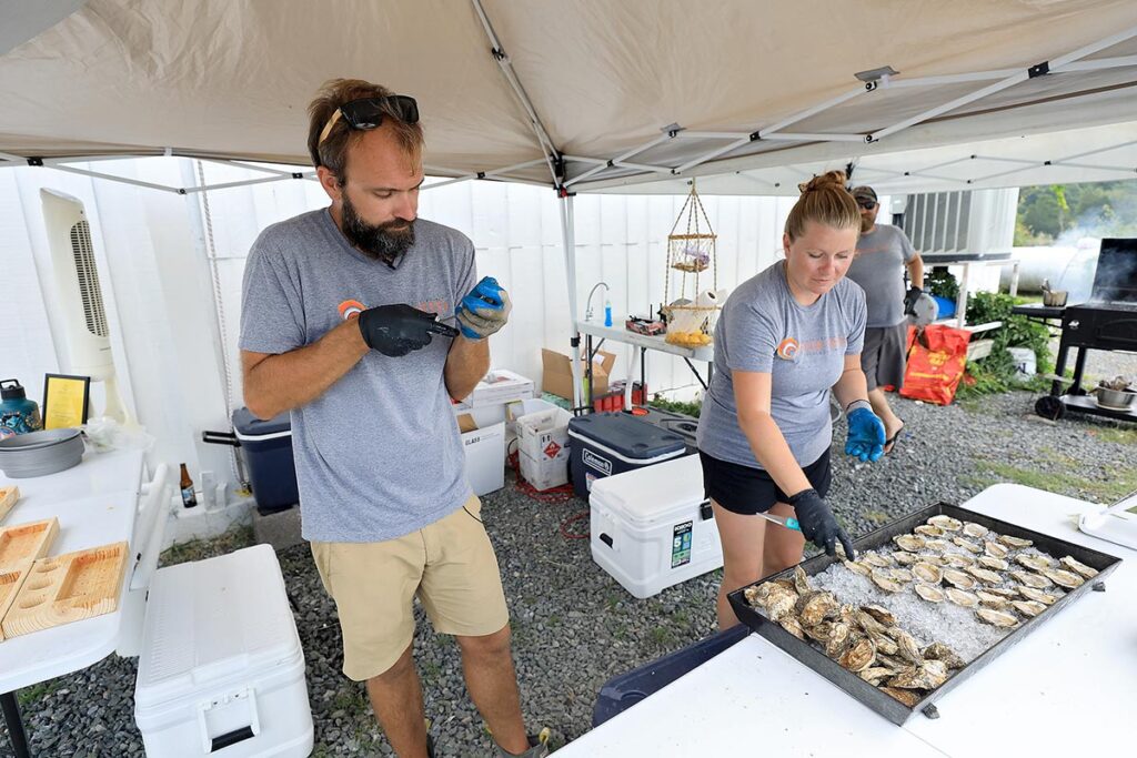 Serving up fresh oysters after a public tour at Oyster Seed Holdings Friday August 5, 2022.